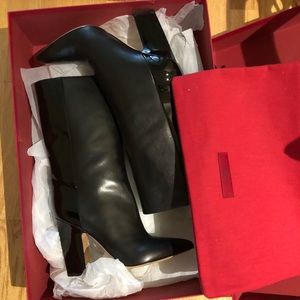 Valentino Garavani Mid-Calf patent leather boots.